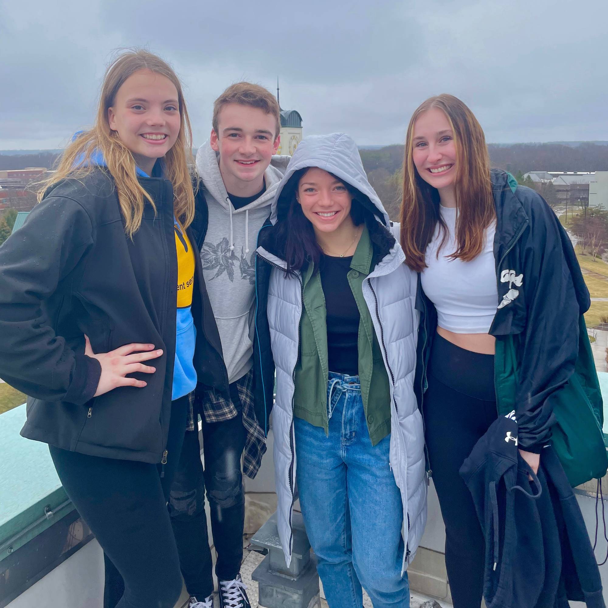 Student Senators pose on the library roof during a facilities tour